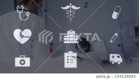Doctor monitoring patient breathing through oxygen mask in hospital ward, with IV drip and icons 134139093