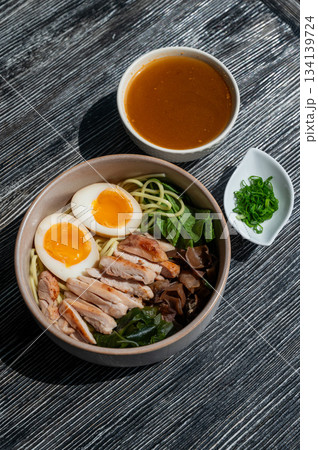 Ramen soup in a cafe. Broth separately. Ramen soup in a cafe. Broth separately. 134139724