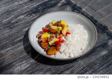 Chicken with pineapple in teriyaki sauce with fried rice. Chicken with pineapple in teriyaki sauce with fried rice. 134139852