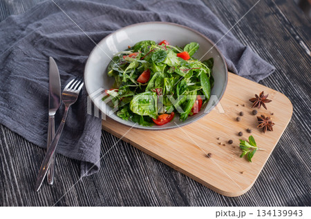 Green salad served in a cafe. Green salad served in a cafe. 134139943