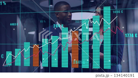 Analysts wearing suits discussing data in office with digital bar and line charts, currency symbols Analysts wearing suits discussing data in office with digital bar and line charts, currency symbols 134140191