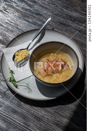Chicken broth with noodles on a wooden table. Chicken broth with noodles on a wooden table. 134140301