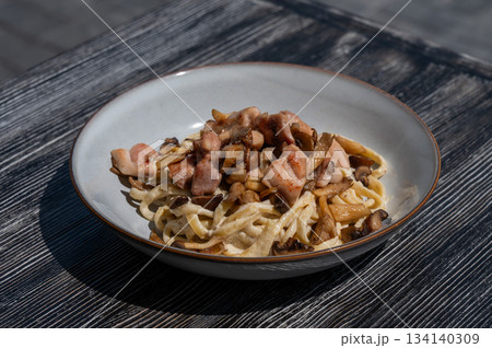 Plate of chicken and mushroom pasta. Plate of chicken and mushroom pasta. 134140309