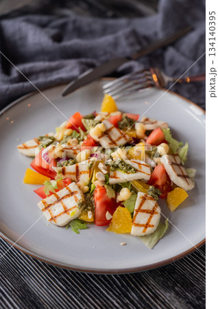 Salad with mozzarella cheese and oranges.  134140395