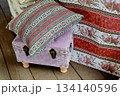 Small pink ottoman chest with pillow. For styling and picnic. On the open veranda 134140596