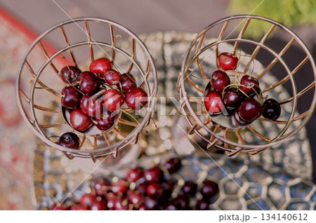 Cherries in large golden dishes Chic serving of dishes. Fruit 134140612