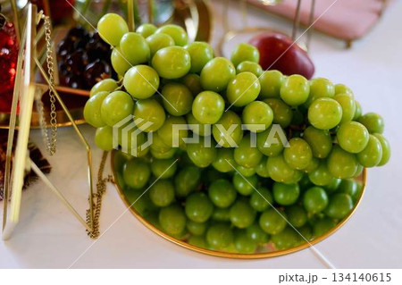 Large juicy grapes on a mirror surface. Vegetarian food 134140615