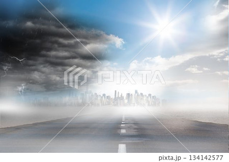 Asphalt road is stretching into misty skyline under split stormy clouds and bright sun flat design 134142577