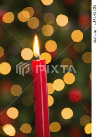 Lit red candles burning during Christmas 134142808