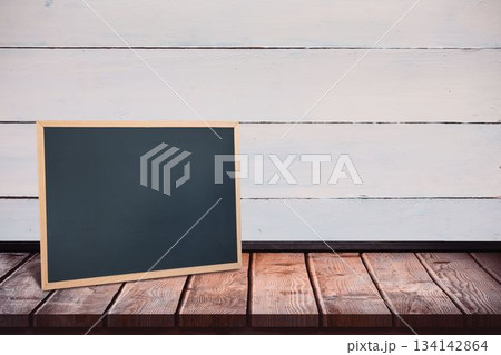 Black board on a wooden table Black board on a wooden table 134142864