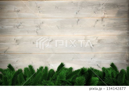 Fir branches over wooden planks Fir branches over wooden planks 134142877