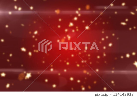 Golden bokeh particles drifting across digital red gradient and casting soft sparkles and lens fla 134142938