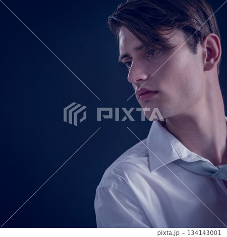 Close up of thoughtful young man looking away 134143001