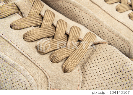 Brown suede lace-up shoes close-up 134143107