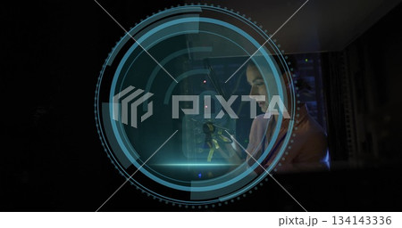 Holding keys, IT tech unlocking server racks at data center, with holographic interface and LEDs 134143336