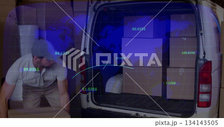 Male worker bending and lifting box in warehouse, with white cargo van, digital overlay, copy space 134143505