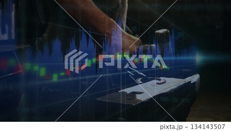 Hammering leather-aproned blacksmith forging glowing rod on anvil in forge with financial overlays 134143507