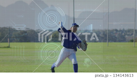 Throwing baseball player in blue white uniform on field, with baseball glove and data overlays Throwing baseball player in blue white uniform on field, with baseball glove and data overlays 134143613