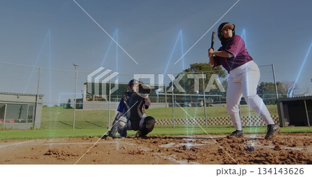 Positioning catcher wearing mitt and shin guards facing batter gripping bat at homeplate fence 134143626