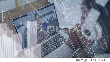 Working man in business attire typing on laptop at office desk, with data overlays, copy space Working man in business attire typing on laptop at office desk, with data overlays, copy space 134143710