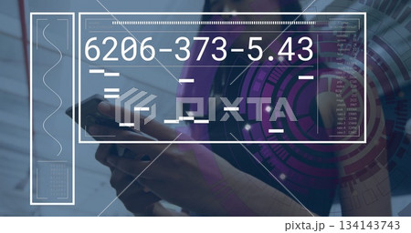 Holding smartphone businesswoman using AR interface in corporate lobby, data visualization Holding smartphone businesswoman using AR interface in corporate lobby, data visualization 134143743