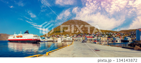 Cityscape on a sunny day. Embankment in the city with blue sky. Honningsvag cruise port. Horizontal banner 134143872