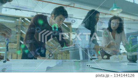 Discussing three professionals in business attire analyzing blueprint and digital overlay in office Discussing three professionals in business attire analyzing blueprint and digital overlay in office 134144126