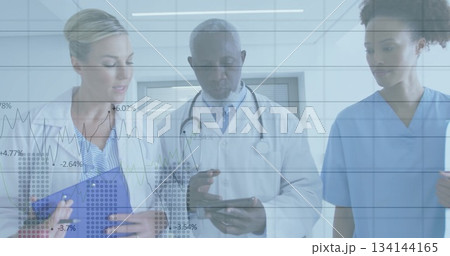 Walking medical team checking data in hospital hall, with clipboard, tablet, stethoscope, overlays Walking medical team checking data in hospital hall, with clipboard, tablet, stethoscope, overlays 134144165