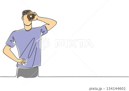 Stylish single line drawing of man holding donut in front of eye, reflecting joy, playfulness, and lifestyle sweetness in a symbolic concept for National Donut Day celebration. Stylish single line drawing of man holding donut in front of eye, reflecting joy, playfulness, and lifestyle sweetness in a symbolic concept for National Donut Day celebration. 134144601