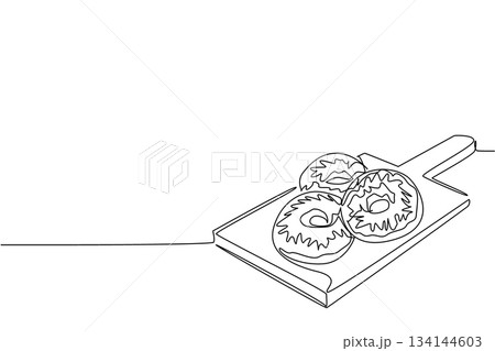 Continuous line drawing of donuts placed on a cutting board, representing a food concept of homemade sweetness and indulgence, created for National Donut Day celebration of joy. Continuous line drawing of donuts placed on a cutting board, representing a food concept of homemade sweetness and indulgence, created for National Donut Day celebration of joy. 134144603
