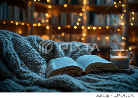 This image captures a cozy reading nook beside a rain-streaked window, perfect for relaxation on a rainy day. 134145176