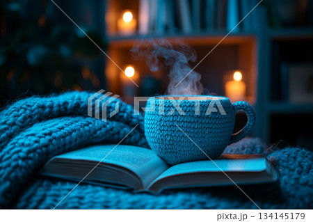 This image captures a cozy reading nook beside a rain-streaked window, perfect for relaxation on a rainy day. 134145179