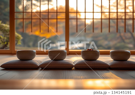 A serene Japanese minimalist interior featuring natural wood, clean lines, soft daylight, and a calm zen-inspired atmosphere. A serene Japanese minimalist interior featuring natural wood, clean lines, soft daylight, and a calm zen-inspired atmosphere. 134145191