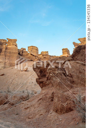 Wide shot of canyon with bizarre rock formations under clear blue sky - wild nature Wide shot of canyon with bizarre rock formations under clear blue sky - wild nature 134145336
