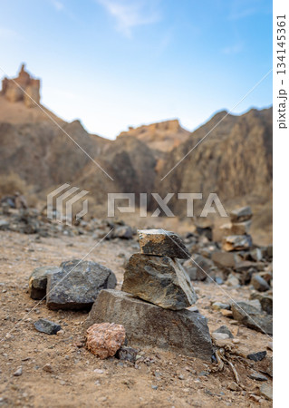 Close-up of stacked stones in desert - wild nature and geology Close-up of stacked stones in desert - wild nature and geology 134145361