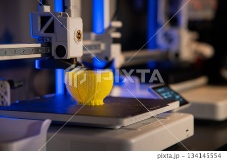 A student man print prototype on 3D printer 134145554