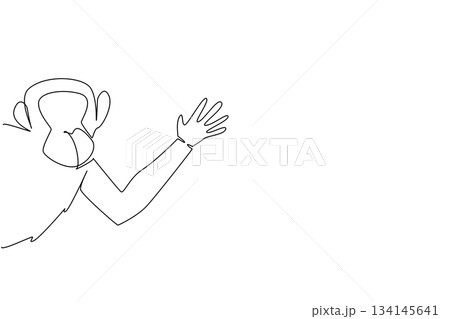 Continuous line drawing of a chimpanzee waving hand behind the wall, symbolizing playful wildlife. Created as an art concept for International Animal Day, highlighting animal charm. 134145641