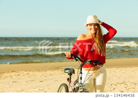 Beauty tourist with bike on beach. Beauty tourist with bike on beach. 134146438