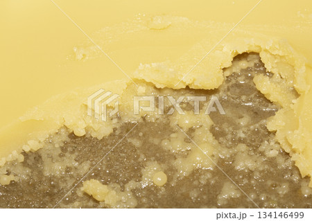 Rendered animal fat tallow lard melting chicken close up 134146499