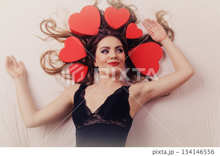 Woman in lingerie in bed. Valentines day love. Woman in lingerie in bed. Valentines day love. 134146556