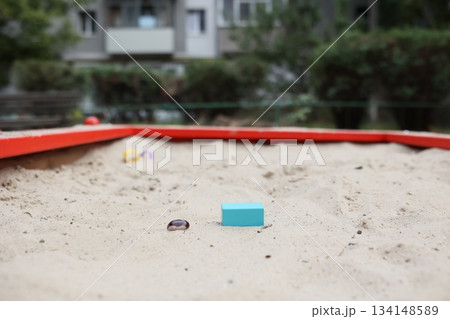 Sandbox with various outdoor toys. Sandbox for children's games. Summer concept. Sandbox with various outdoor toys. Sandbox for children's games. Summer concept. 134148589