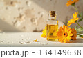 カレンデュラ精油と黄色い花／自然光・ボタニカル・アロマ・美容素材 134149638