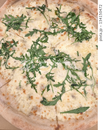 Delicious pizza with four cheese and arugula in prague 134150472