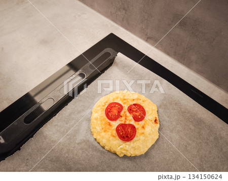 Mini cottage cheese pizzas omelette featuring tomato slice smile, representing romantic breakfast mood for valentine's day morning Mini cottage cheese pizzas omelette featuring tomato slice smile, representing romantic breakfast mood for valentine's day morning 134150624