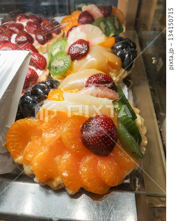 Delicious fruit tarts displayed in bakery window in Mnisek pod brdy Delicious fruit tarts displayed in bakery window in Mnisek pod brdy 134150715