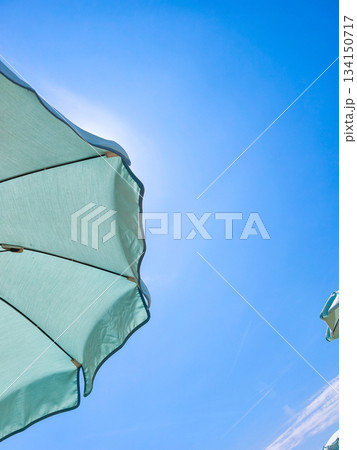 Beach umbrella protecting from sun on clear sky in lignano sabbiadoro 134150717