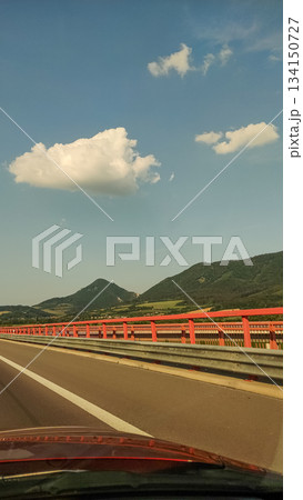 Driving on highway bridge with scenic mountain view in slovakia Driving on highway bridge with scenic mountain view in slovakia 134150727
