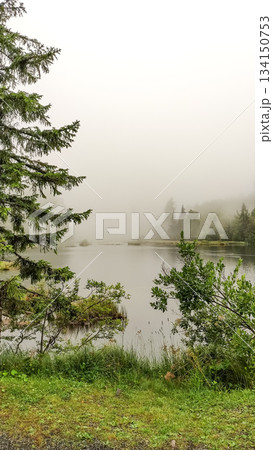 Fog rolling over mountain lake in high tatras, slovakia Fog rolling over mountain lake in high tatras, slovakia 134150753