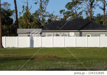 White plastic fence for back yard protection and privacy 134152695