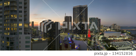 View from above of concrete and glass skyscraper buildings in downtown district of Miami Brickell in Florida, USA at sunset. American megapolis with business financial district at nightfall View from above of concrete and glass skyscraper buildings in downtown district of Miami Brickell in Florida, USA at sunset. American megapolis with business financial district at nightfall 134152816
